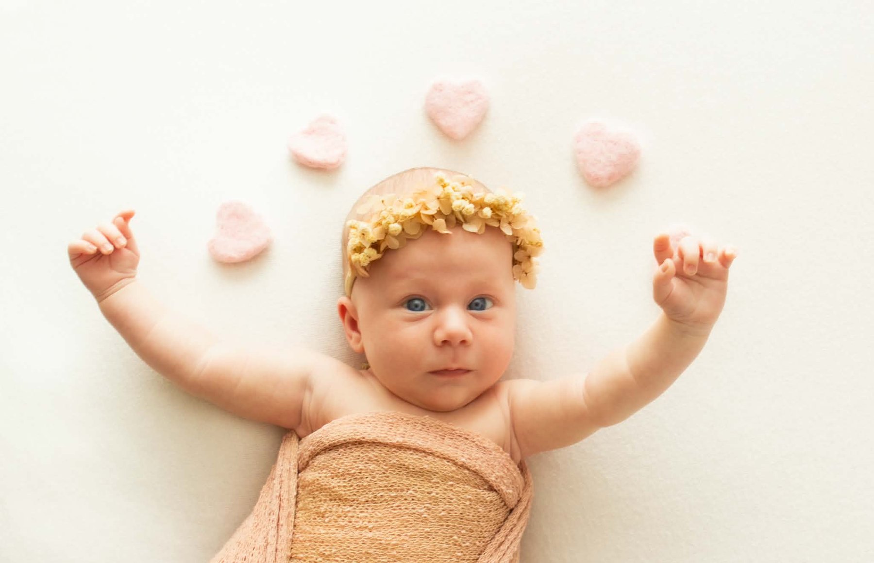 Newborn photography, awake portrait with felt hearts, South Penrith