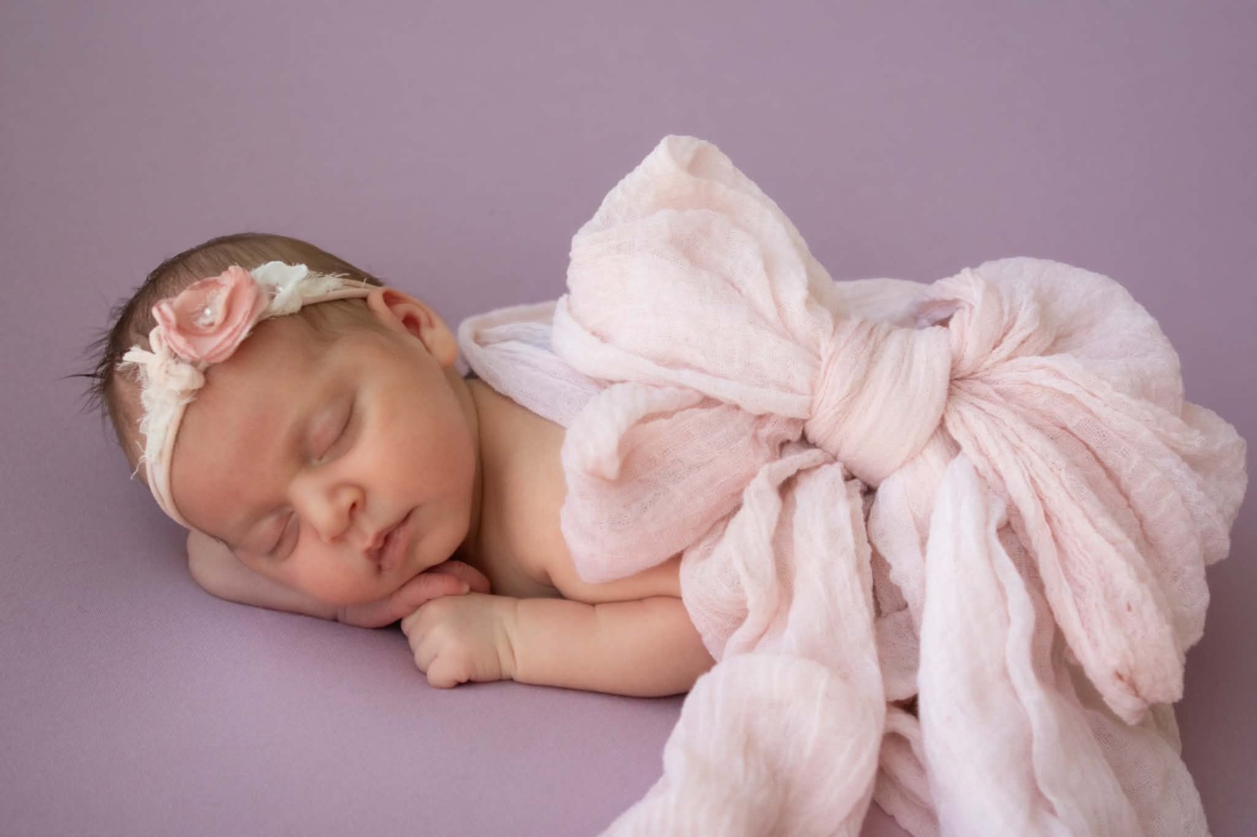 Newborn photography with pink bow wrap, Western Sydney